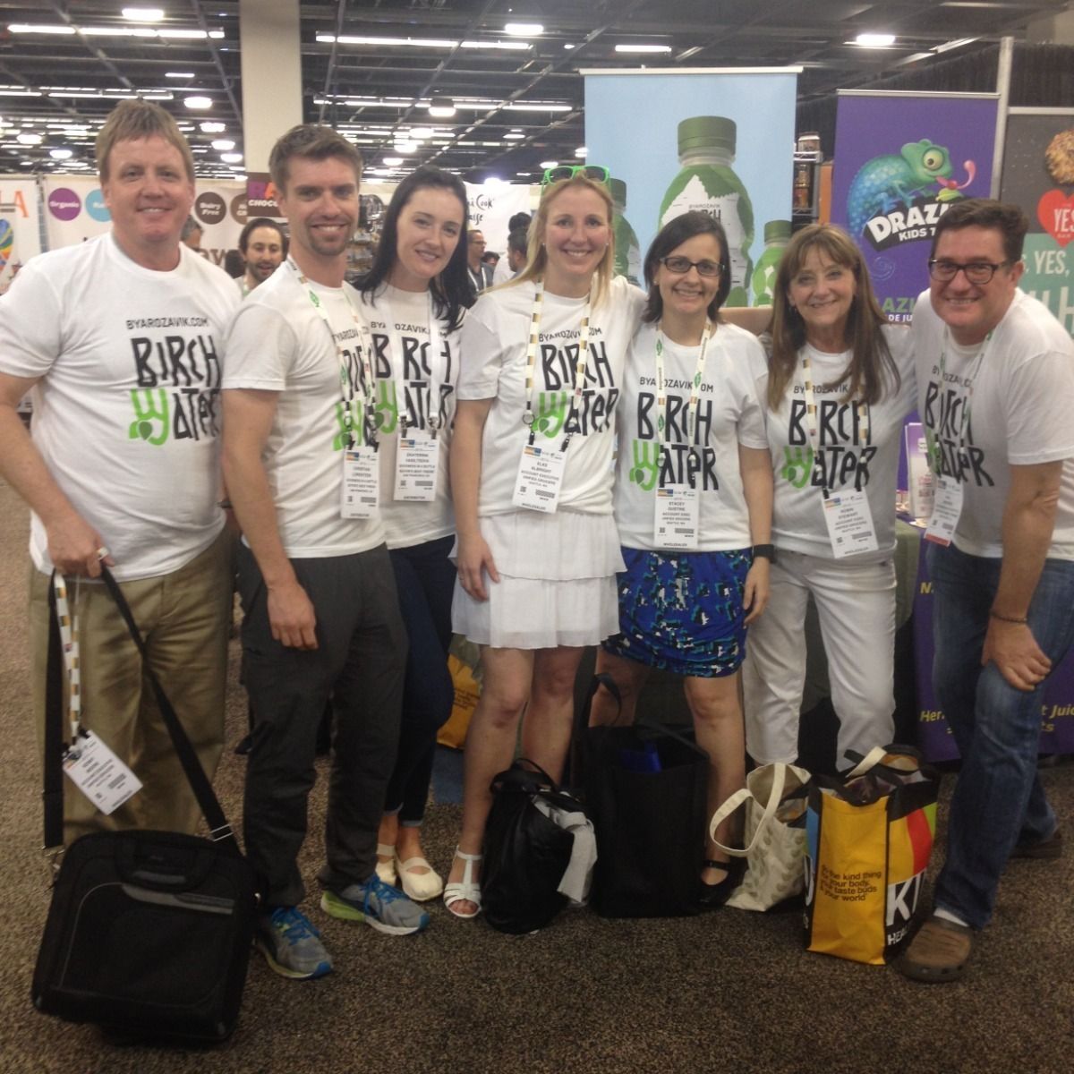 The team in Birch Water T-shirts at the Byarozavik stand, Natural Products Expo West